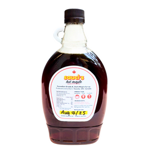 Bottle of Sauci's Hot Maple syrup on a white background